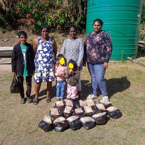 Missions Ablaze: 30 Years of Faith, Service, and Feeding the Hungry We made up parcels for the Families.